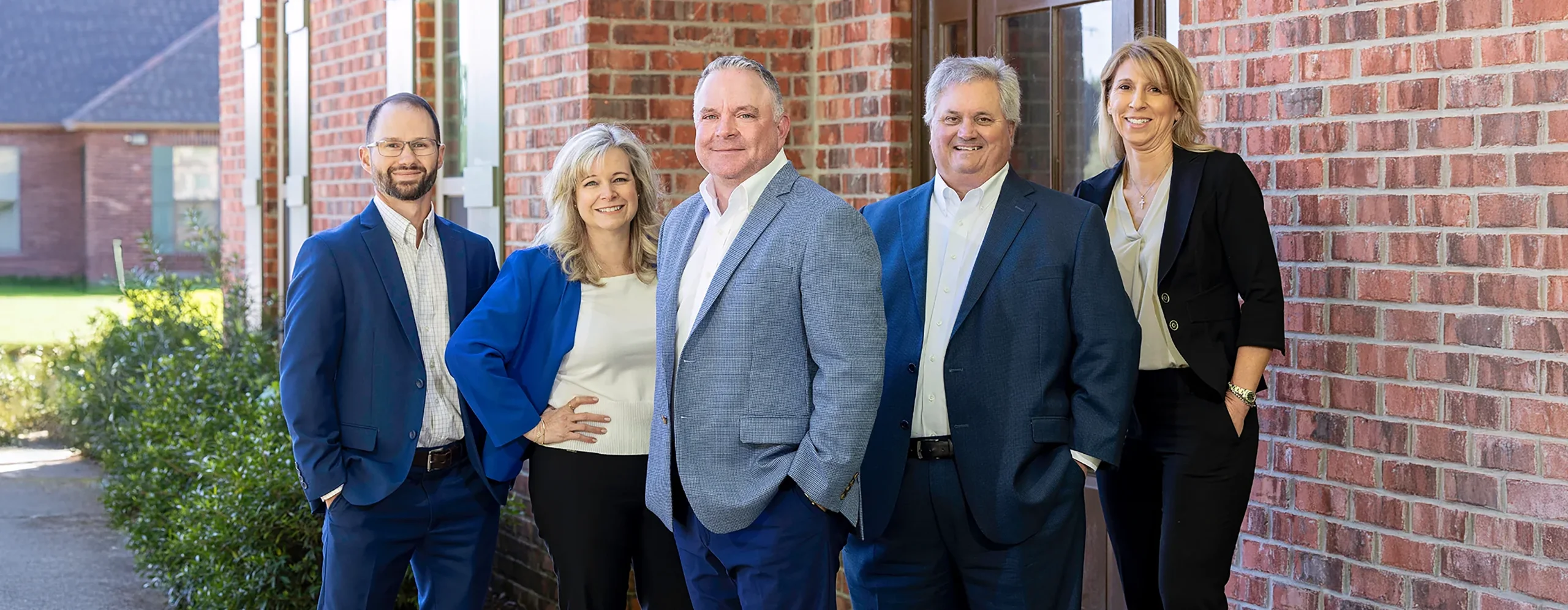 A group of Summit employees with Hughes Insurance president, Bret Hughes.