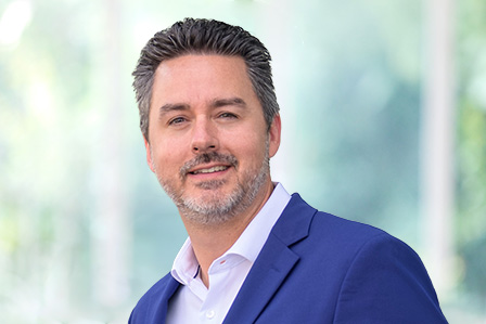 Headshot of James Lumbra.