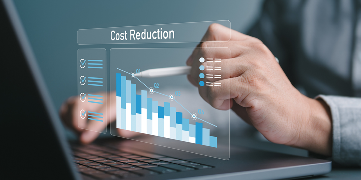 Laptop screen shows a graph that models cost savings over time.